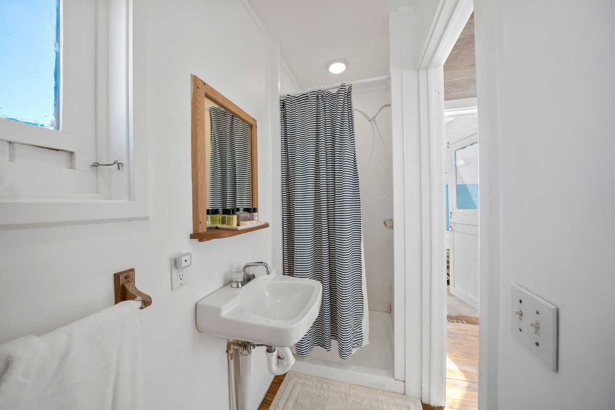 Full (yet small) indoor bathroom at the Harbor House + an enclosed outdoor shower