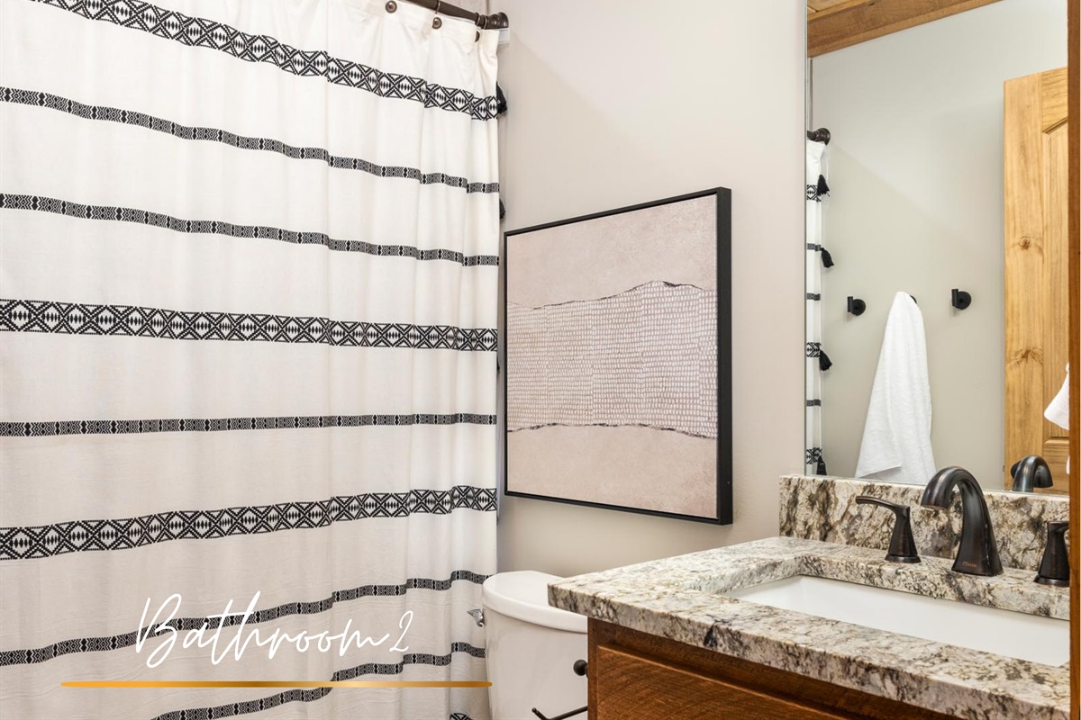 A full bathroom, thoughtfully shared between bedrooms two and three, practical, clean, and elevated.