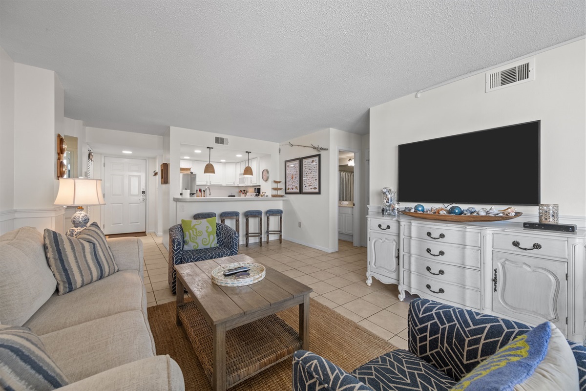Smart TV lounge area perfect for movie nights after a day at the beach