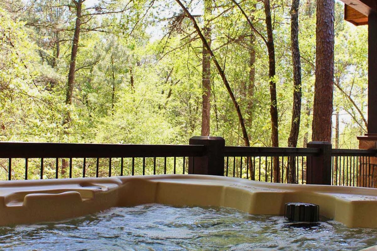 White Tail Waters’ deck hot tub offers the ideal spot to soak, sip, and savor the peace of the surrounding woods.