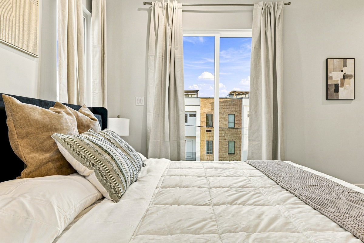 Bright and airy space with plush bedding and stunning city views!
