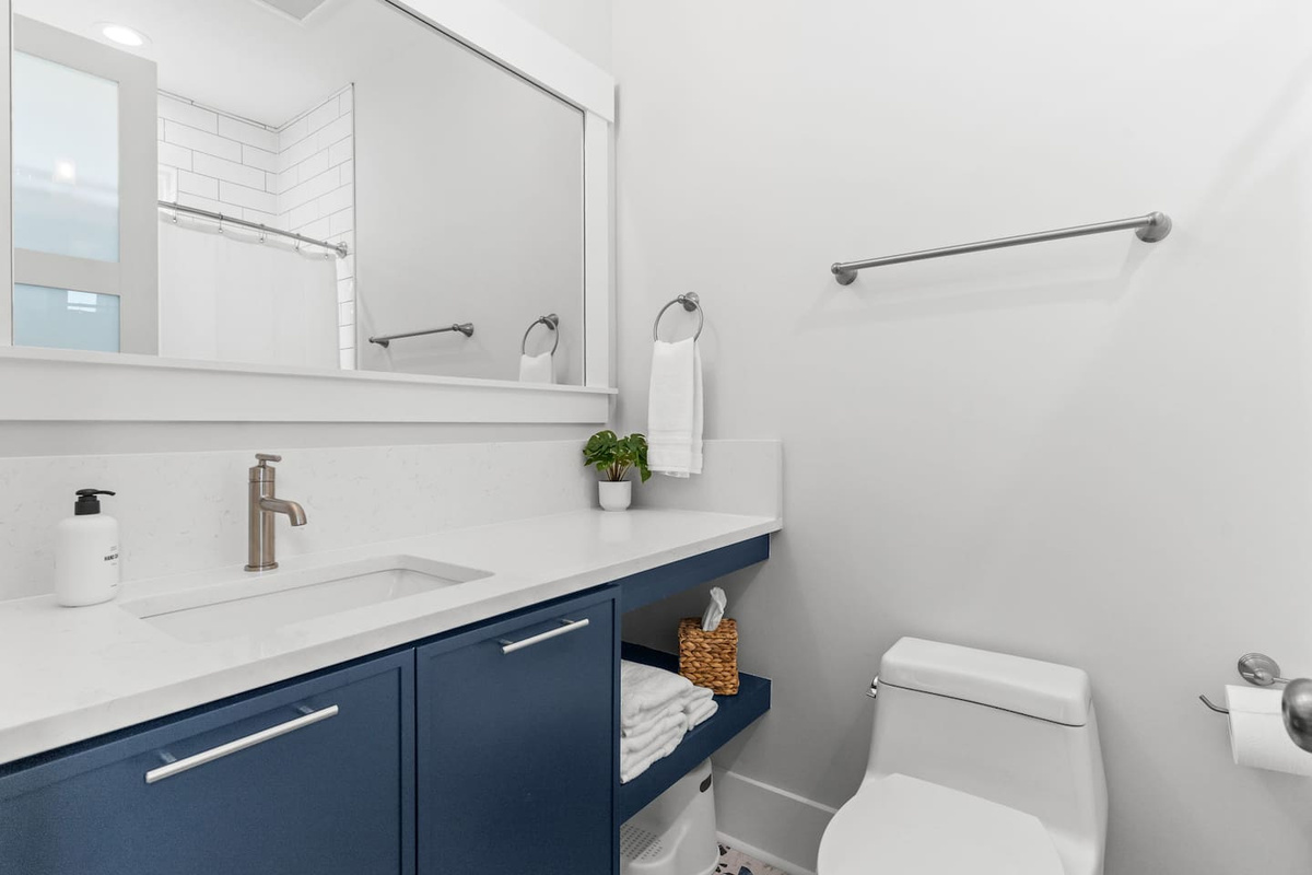 Family-friendly details make vacation easier. The bunk room bathrooms include a tub/shower combo for kids’ bath time, plus a step stool at the sink so little ones can easily wash up and get ready on their own.