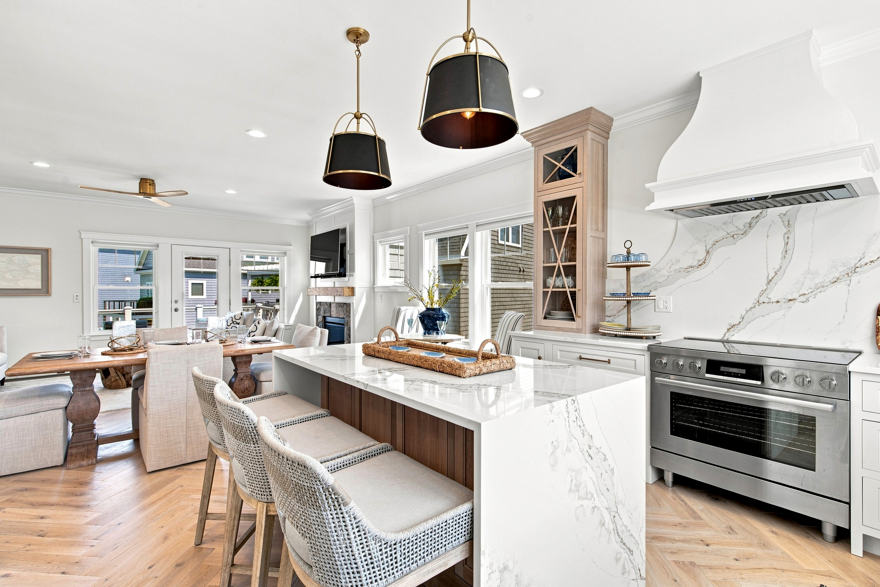 Cook, dine, and gather together around the oversized island at the heart of the home.