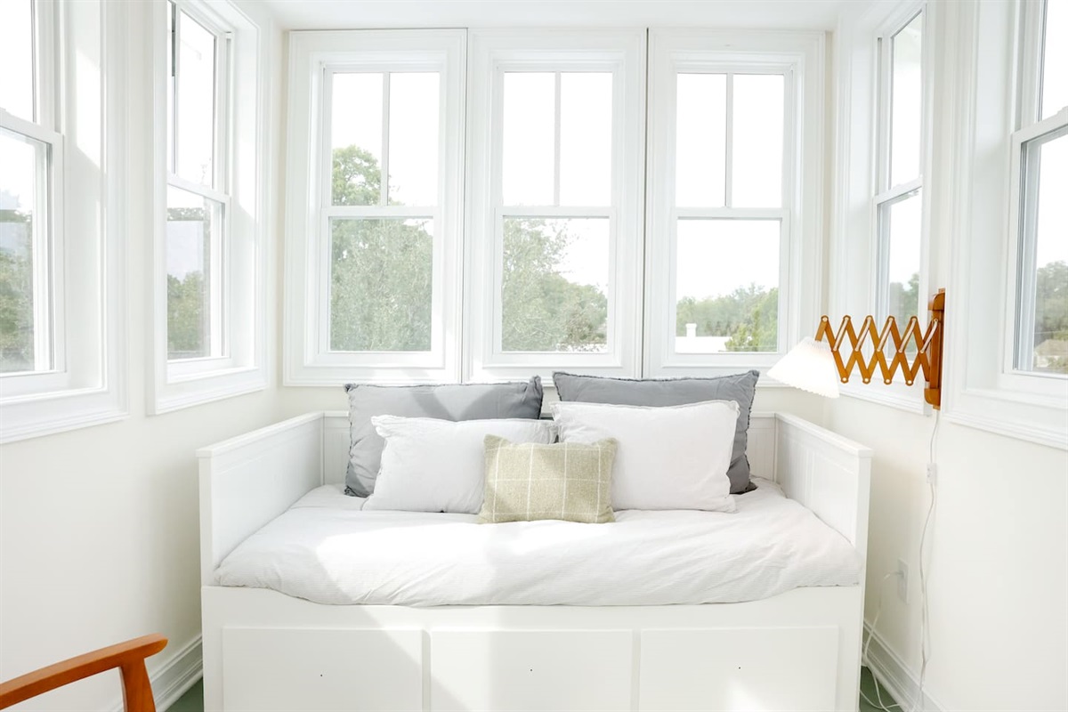 The lookout is surrounded by windows for views of the historic downtown neighborhood. The day bed pulls out into two twin mattresses. 