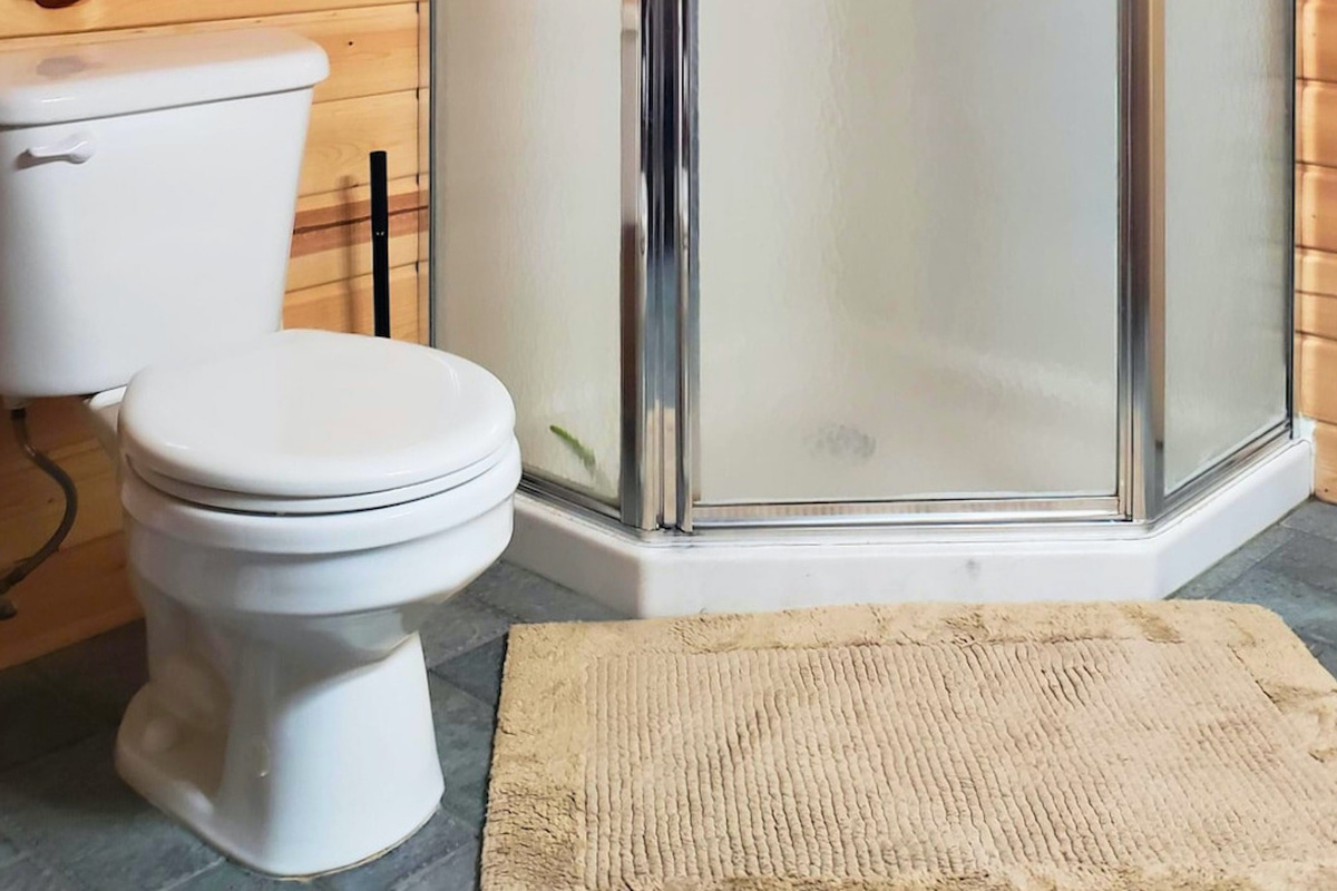 Large corner shower in upstairs bathroom.