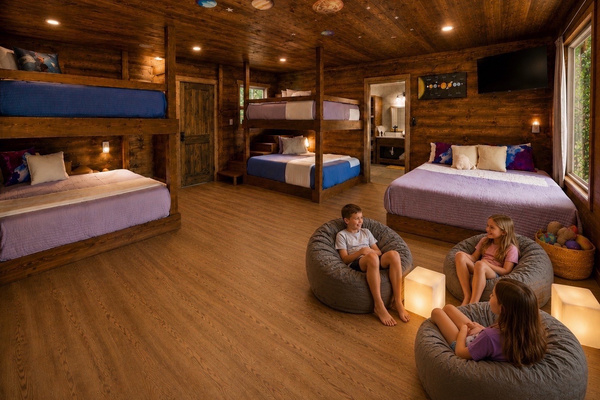 Spacious bunk loft with 5 queen beds — plenty of room for the whole crew!