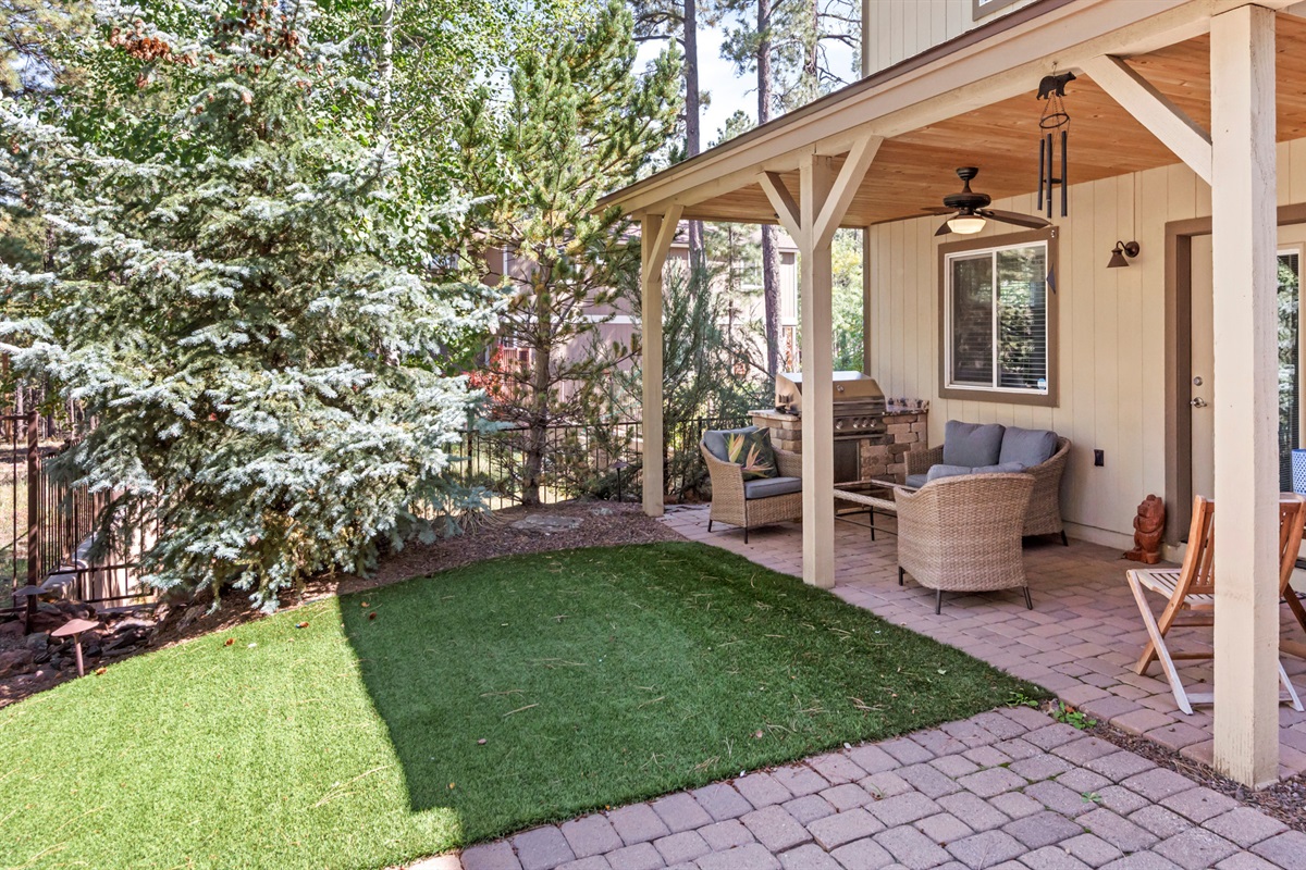 This backyard offers ample space for activities and relaxation, making it a perfect extension of your retreat.