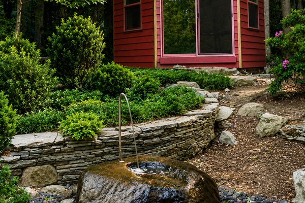 Red Japanese Teahouse  in serene woodland garden.