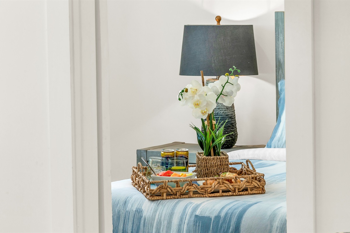 Primary Suite: King-size Tempur-Pedic Pro Adapt mattress, en-suite bath with dual-sink vanity. Pool views. 
