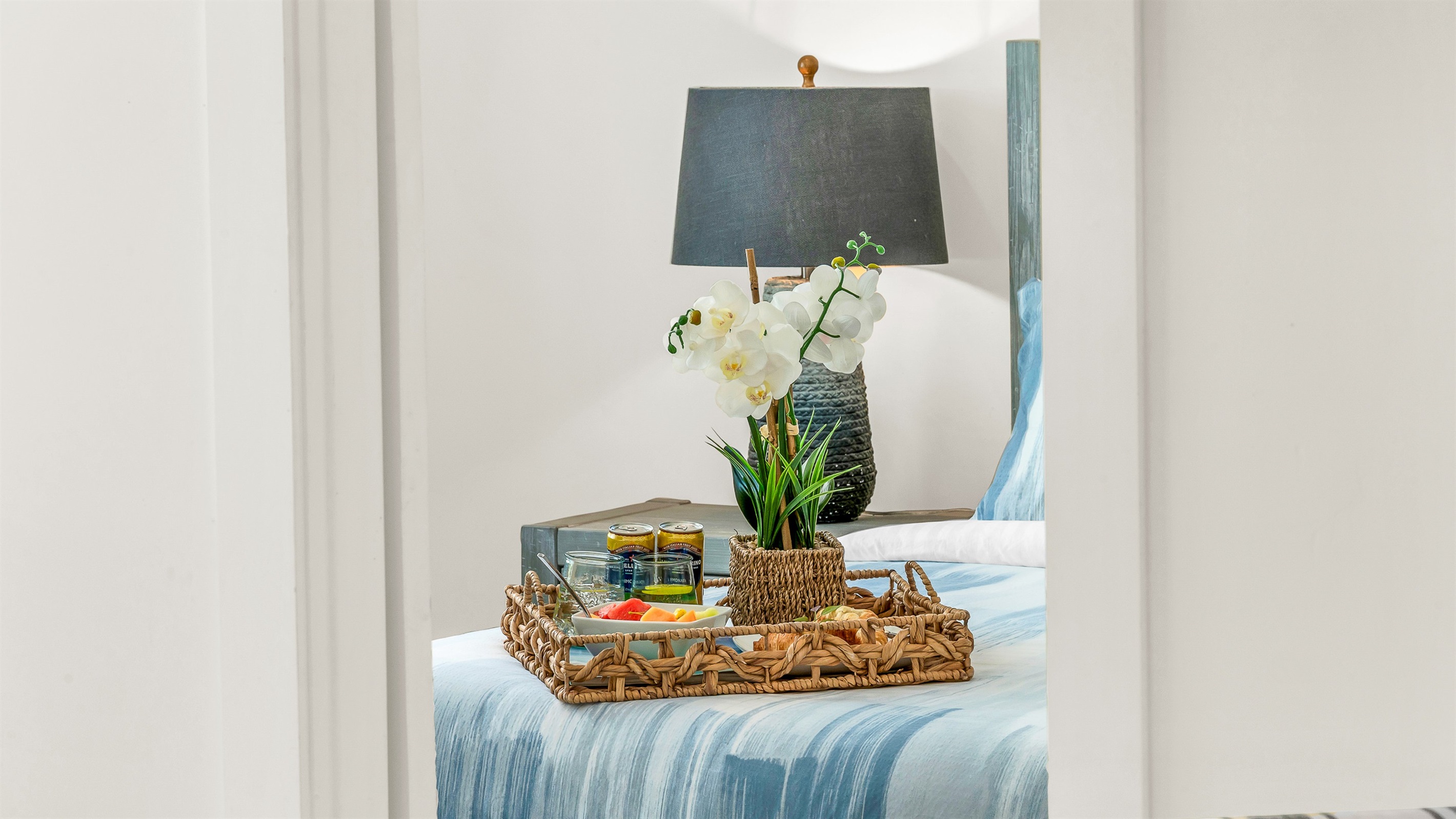 Primary Suite: King-size Tempur-Pedic Pro Adapt mattress, en-suite bath with dual-sink vanity. Pool views. 