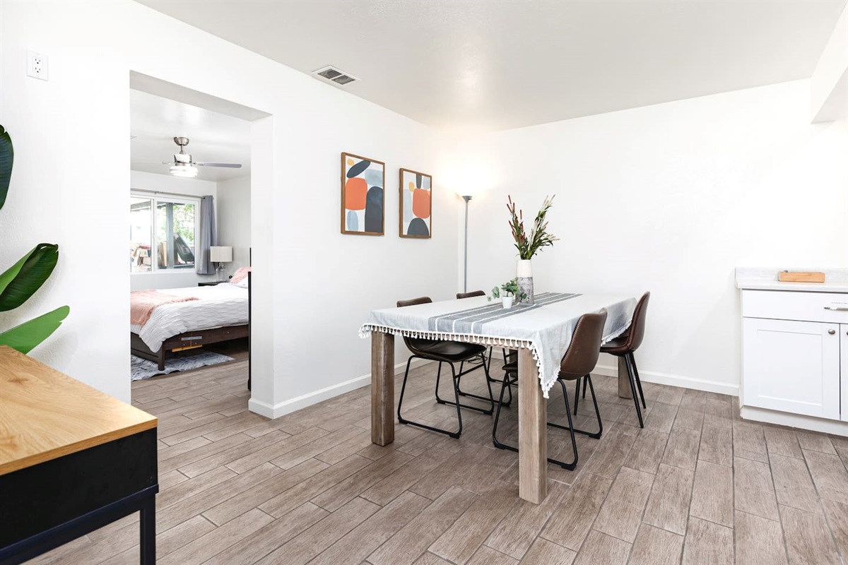 This cozy dining area features clean lines, soft lighting, and a simple modern design perfect for casual meals or morning coffee.

