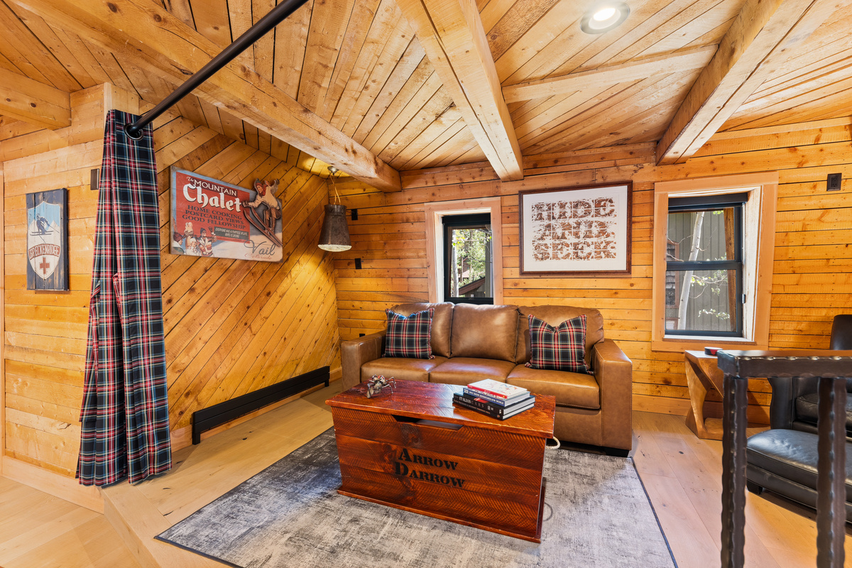 Upper level loft/multi-function living space with partition open. 