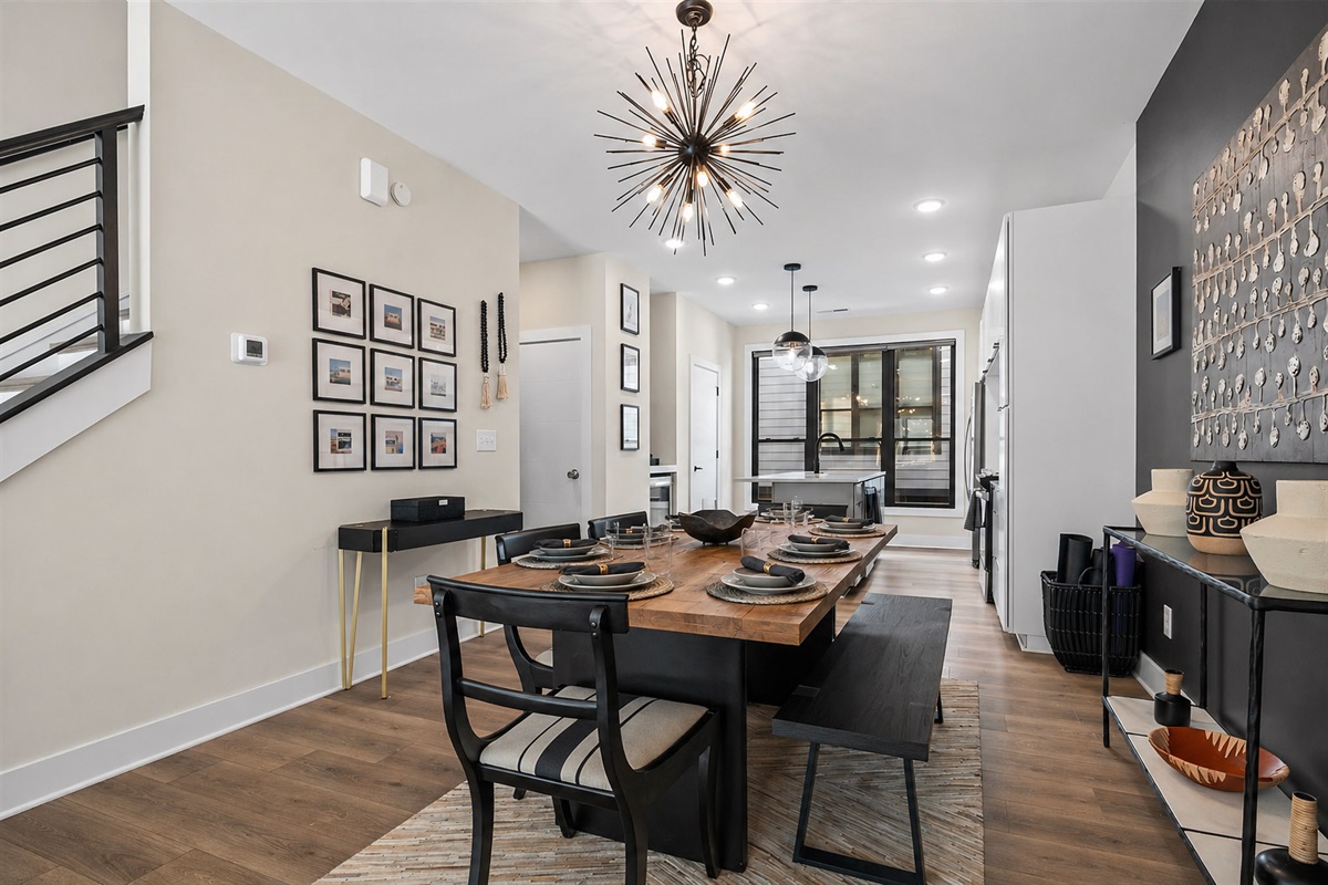 The dining space (with seating for 6) connects the living room to the kitchen. While we also have a dedicated workspace upstairs in the masterbedroom, the table doubles as a work-from-home station for those traveling for work. 