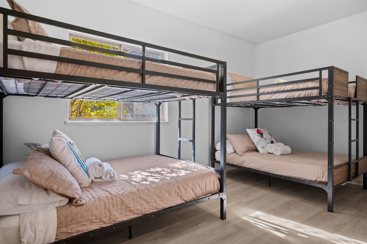 The fifth bedroom features two bunk beds and lots of space to relax.