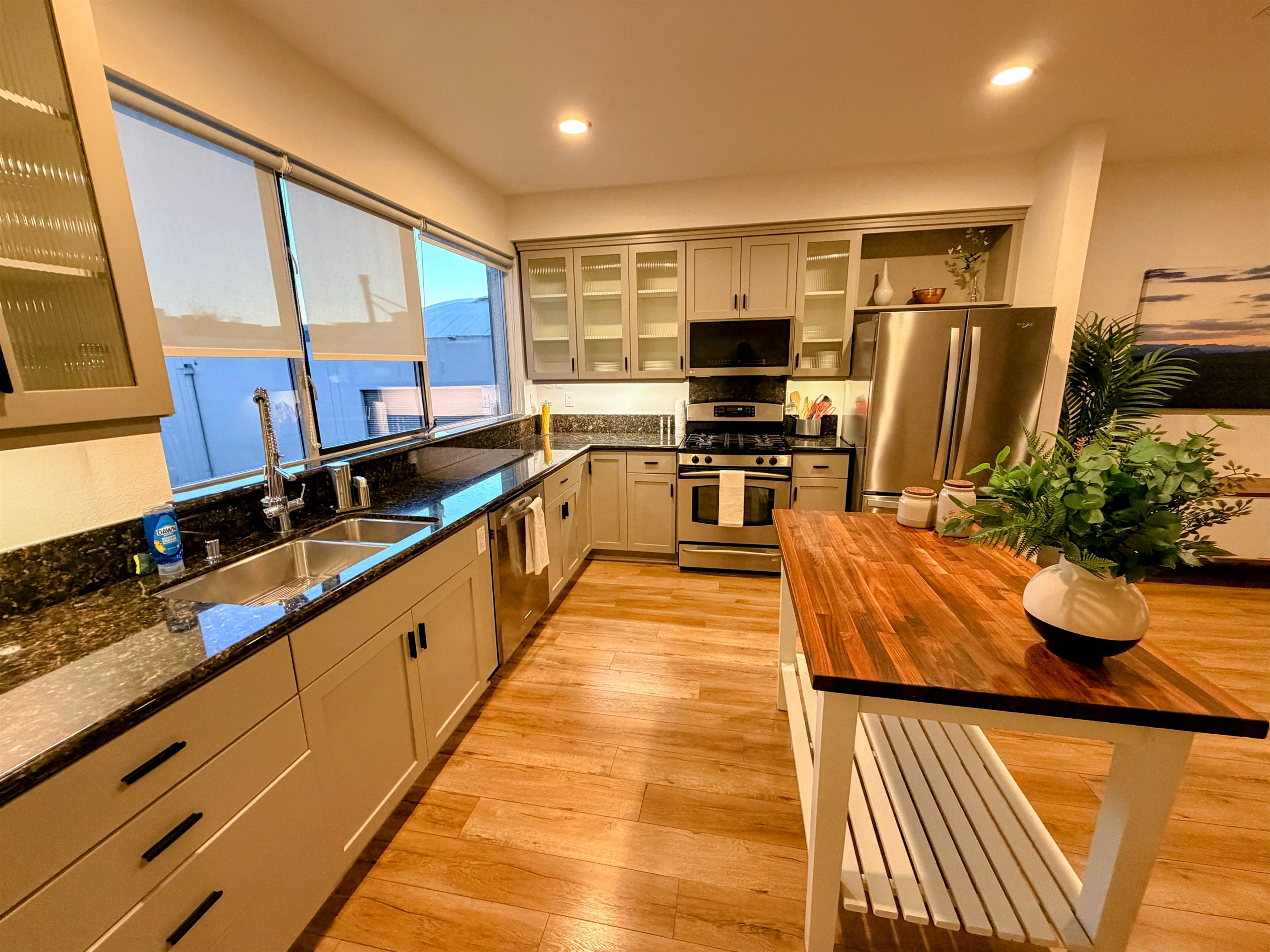 Kitchen looking toward the stove and refrigerator