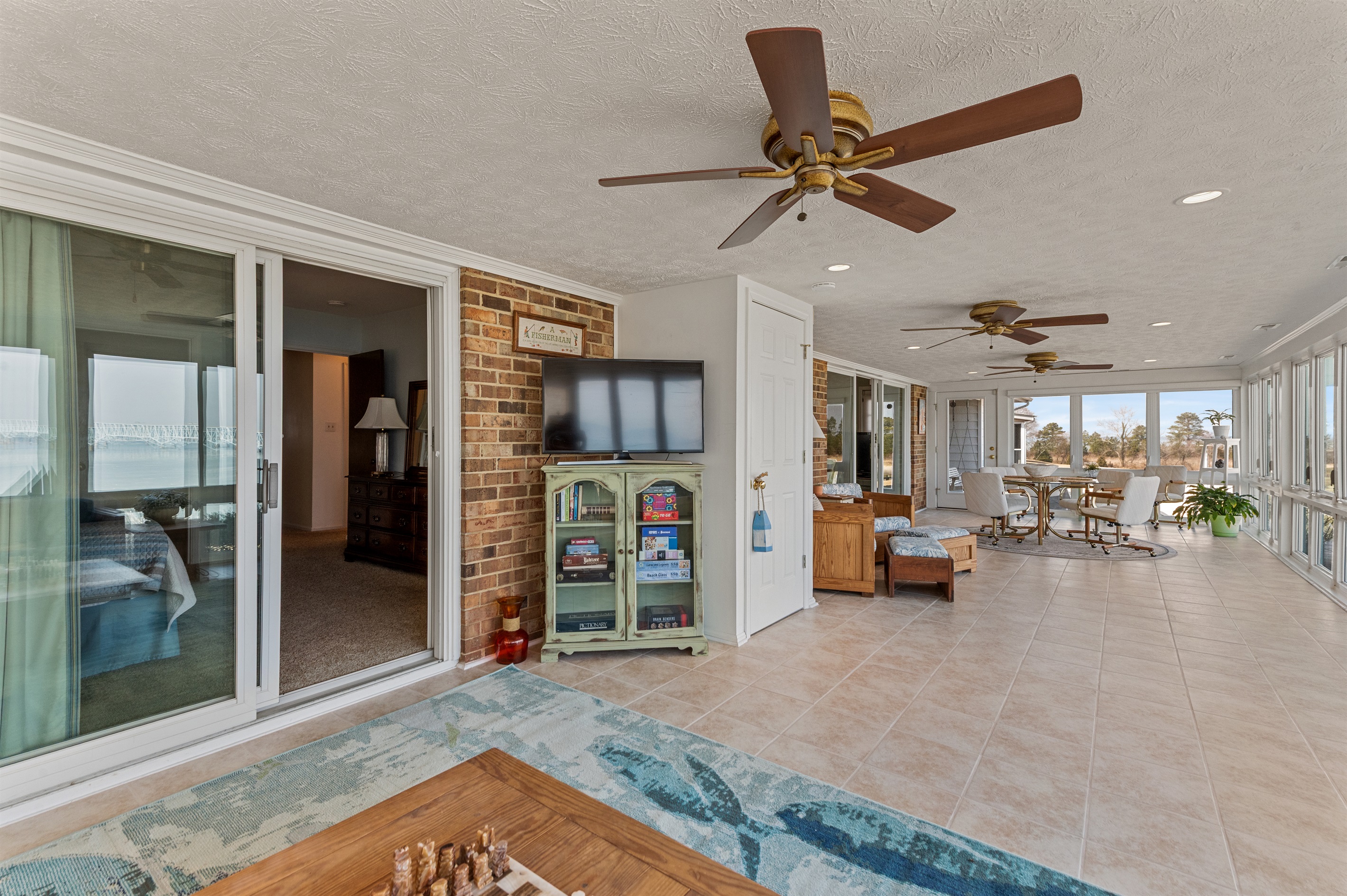 Sunroom Retreat: Bright space with panoramic views, perfect for relaxation and games!
