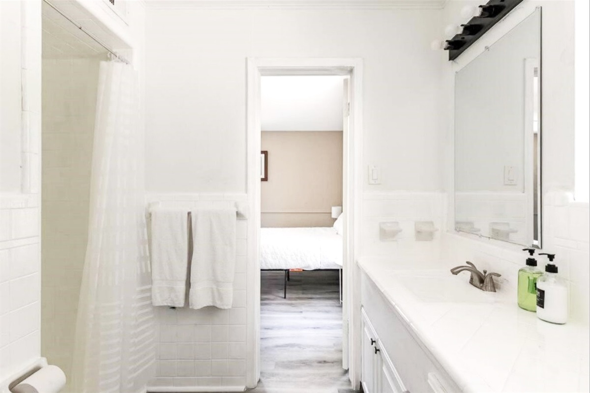 Jack and Jill bathroom with two access doors between the two-queen bedrooms, with the ability to lock both doors from the inside.