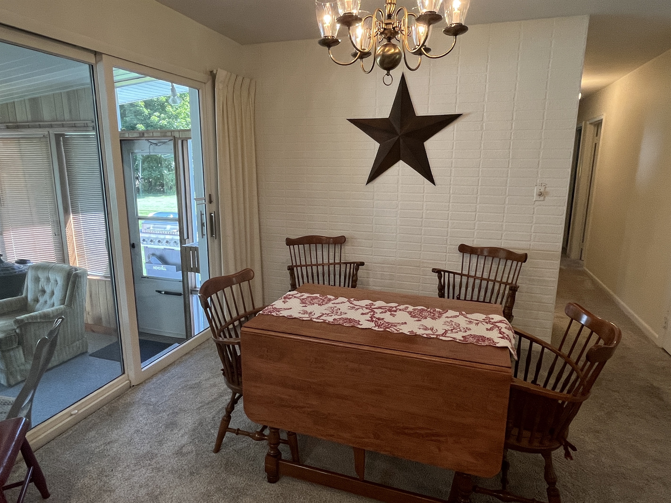 Eat-in kichen with sunroom and BBQ grill beyond