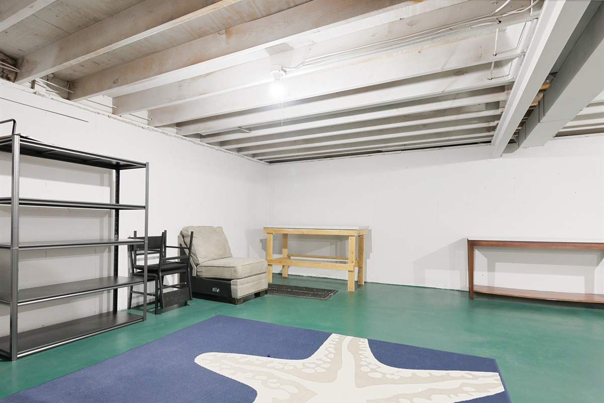 Open basement utility area offering extra space for storage or flexible use.