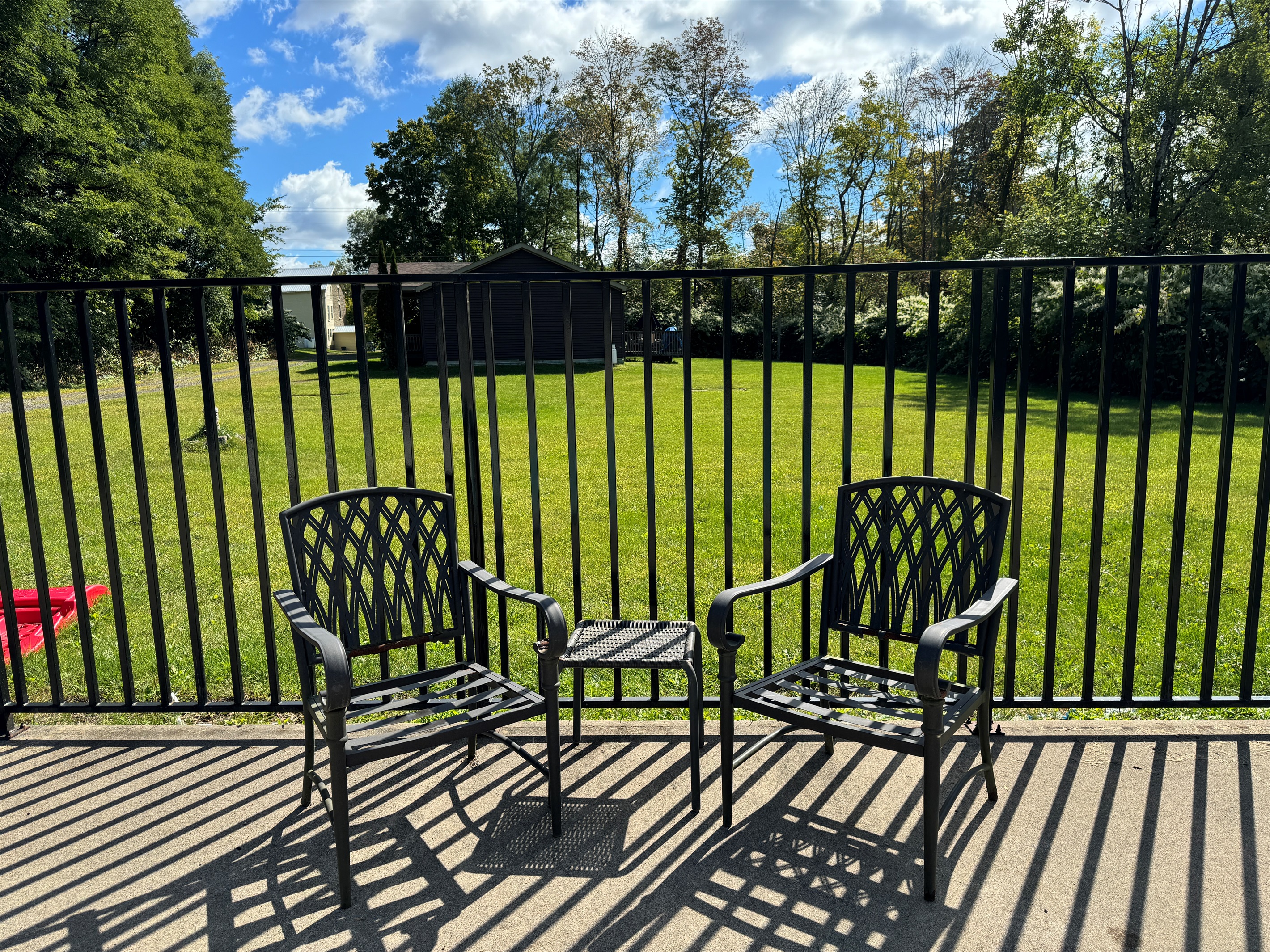 Sitting area at the shared (with two other rentals on site) heated slat-water pool. 