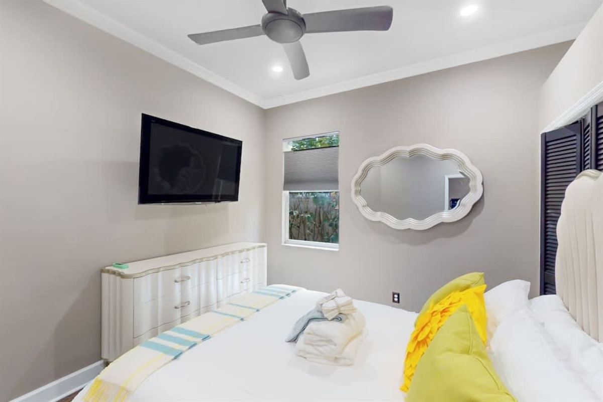 Bright guest room offering calm, airy vibes.