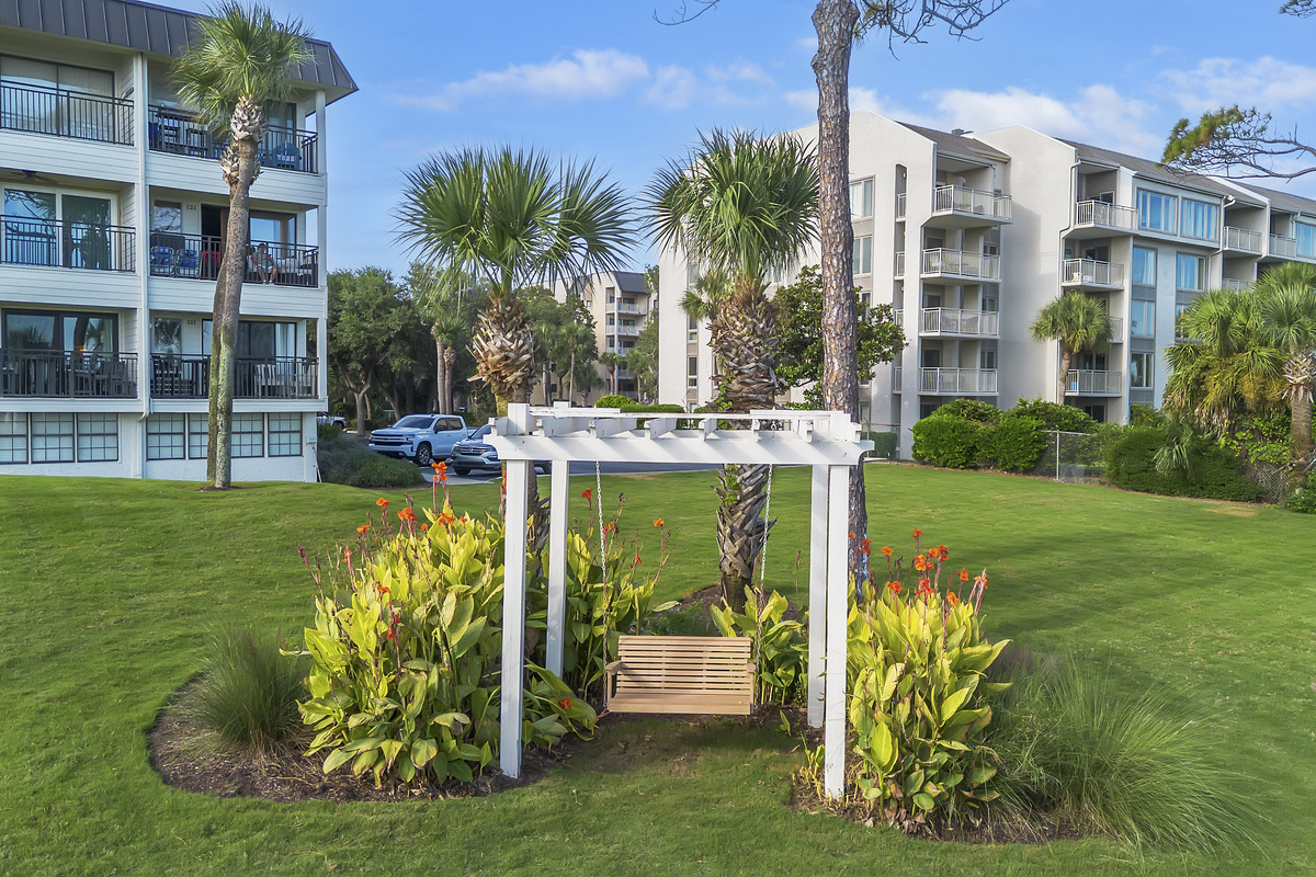 Snuggle up on the beachside swing, right in front of the buildin, and enjoy views of the dunes, South Forest Beach, and the Atlantic Ocean.