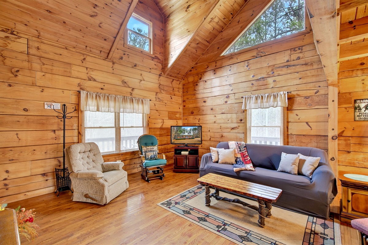 There is a TV in the living room with a Roku