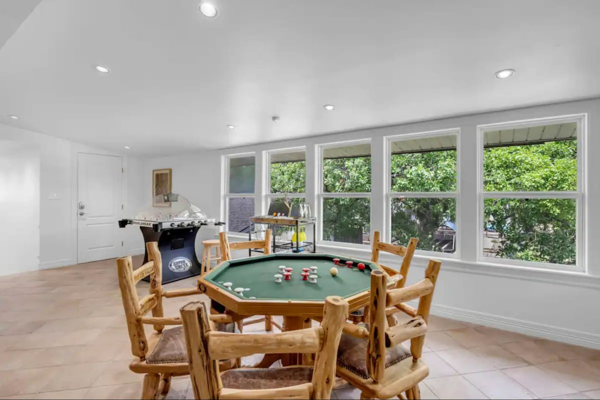 Round poker table that converts to bumper pool and a dining table