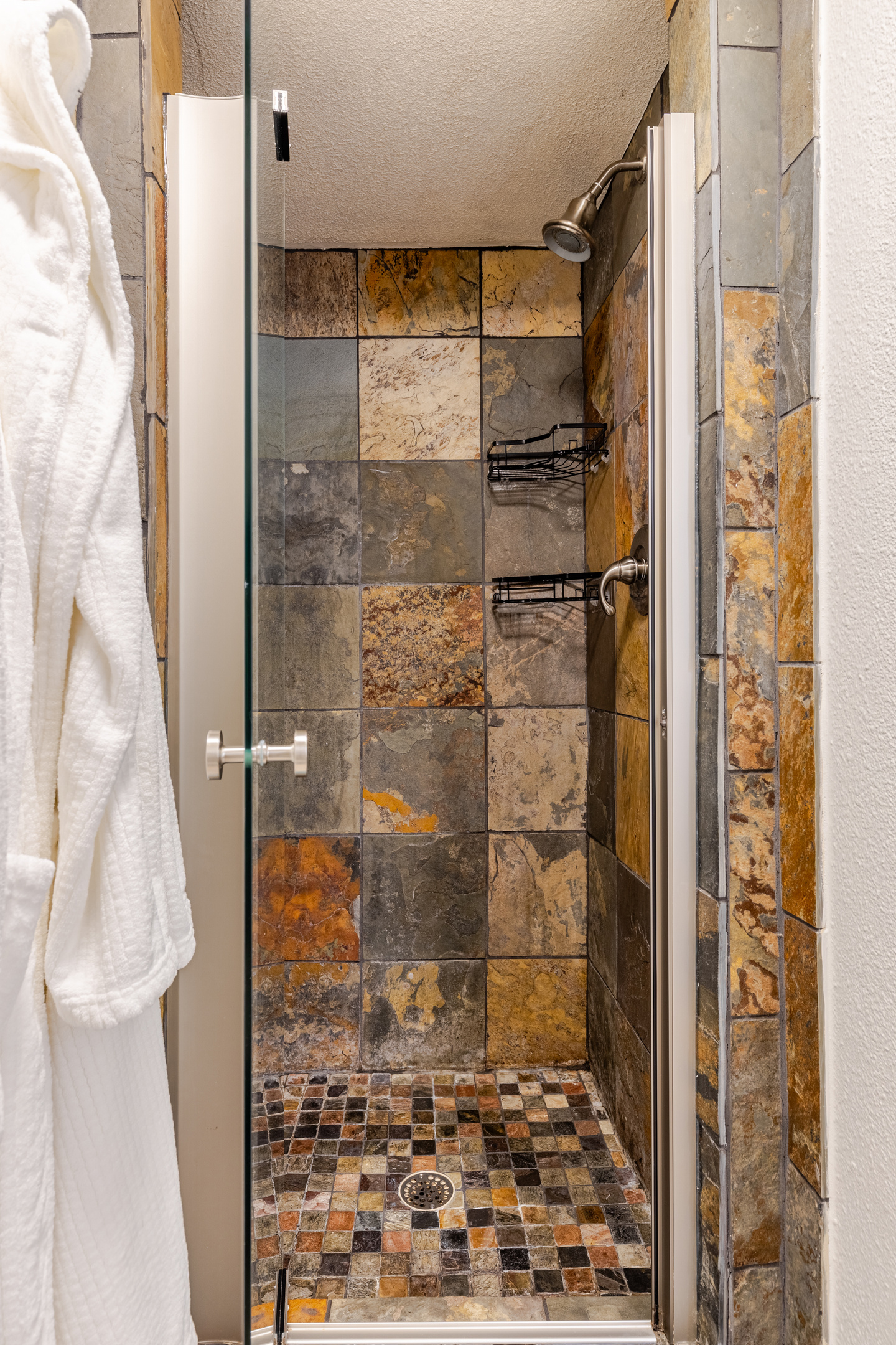 Step into a stunning stone oasis for refreshing rain shower experiences!