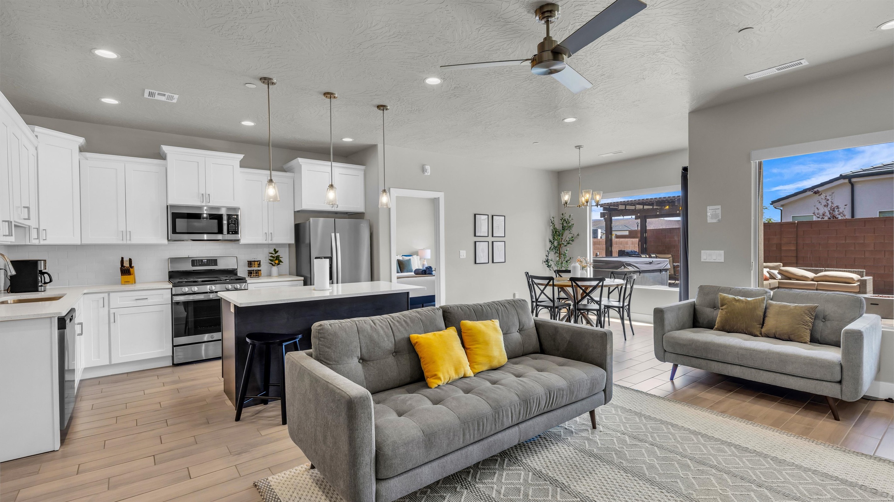 Cozy Living Room Seating Beside Chef’s Kitchen