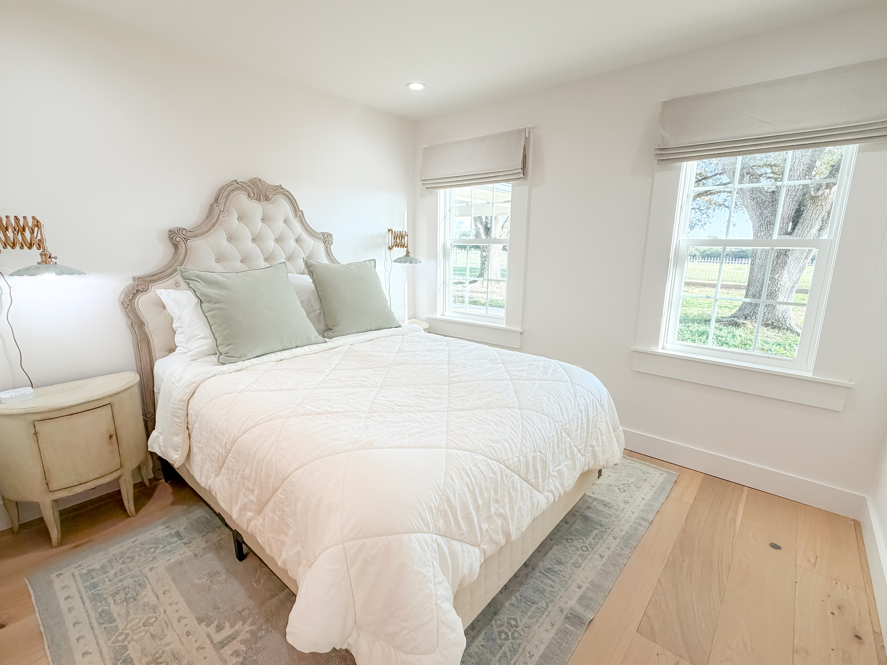 Bright and inviting main bedroom with a queen bed and natural light.
