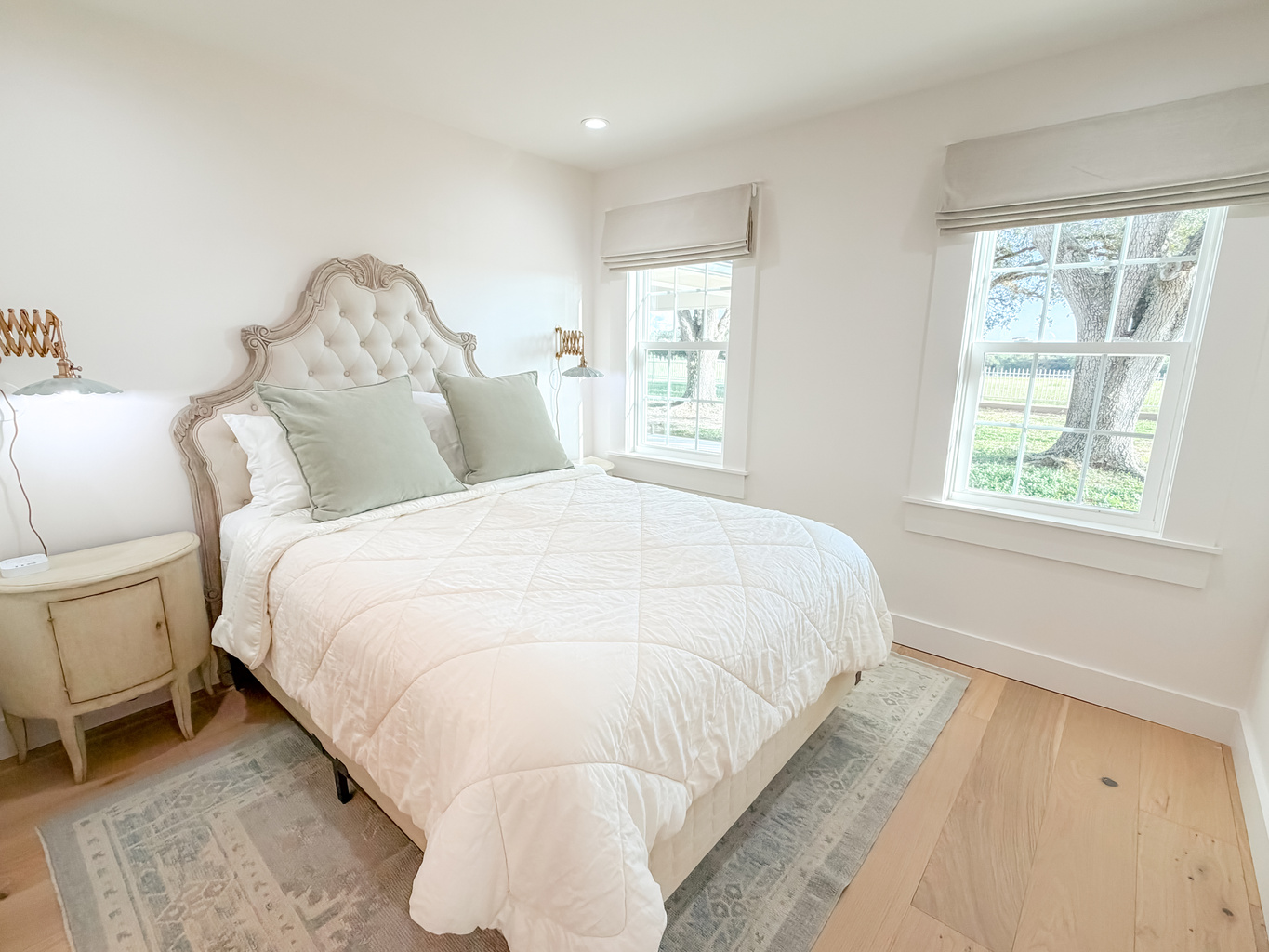 Bright and inviting main bedroom with a queen bed and natural light.