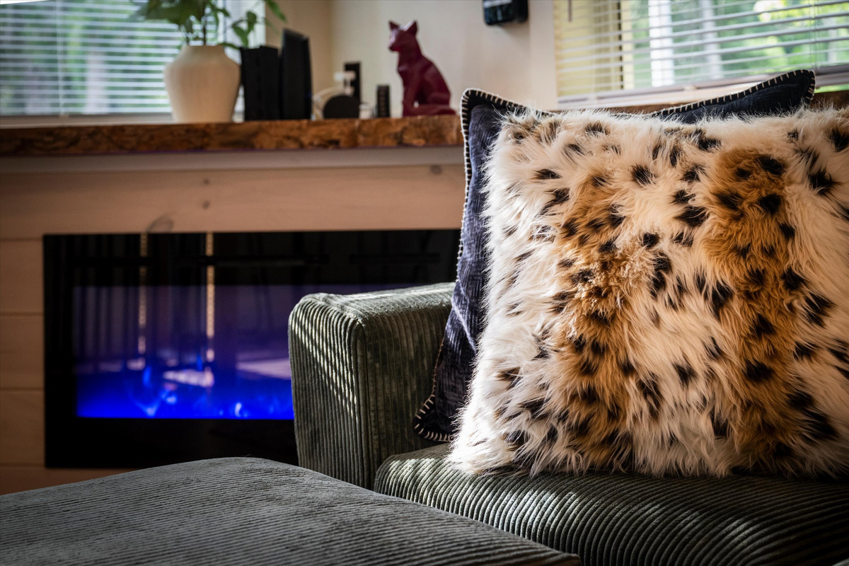 Cozy Living Room with 55-inch Smart TV, Fireplace, and bistro table.
