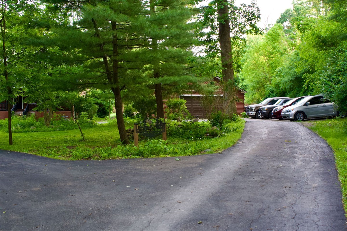 There are approximately 5 parking spaces off the edge of the driveway as shown. One additional car (not pictures) can park parallel to the driveway.