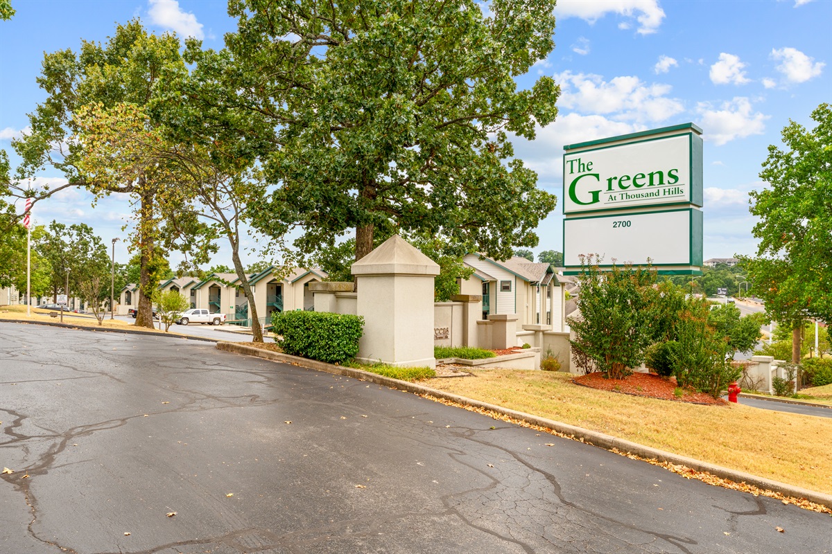 Another view of The Greens signage, marking the condo’s easy-to-find location on Green Mountain Drive.