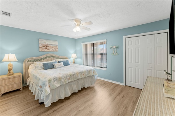 Bedroom #1 with king bed, ceiling fan, smart TV and ensuite bathroom