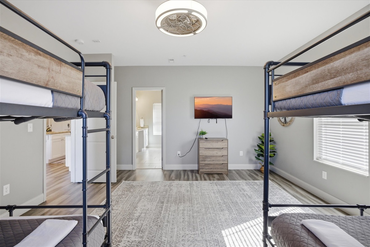 Let this be the group zone—plenty of room to land, recharge, and keep things easy without feeling stacked on top of each other in Unit 1's double queen bunk room.