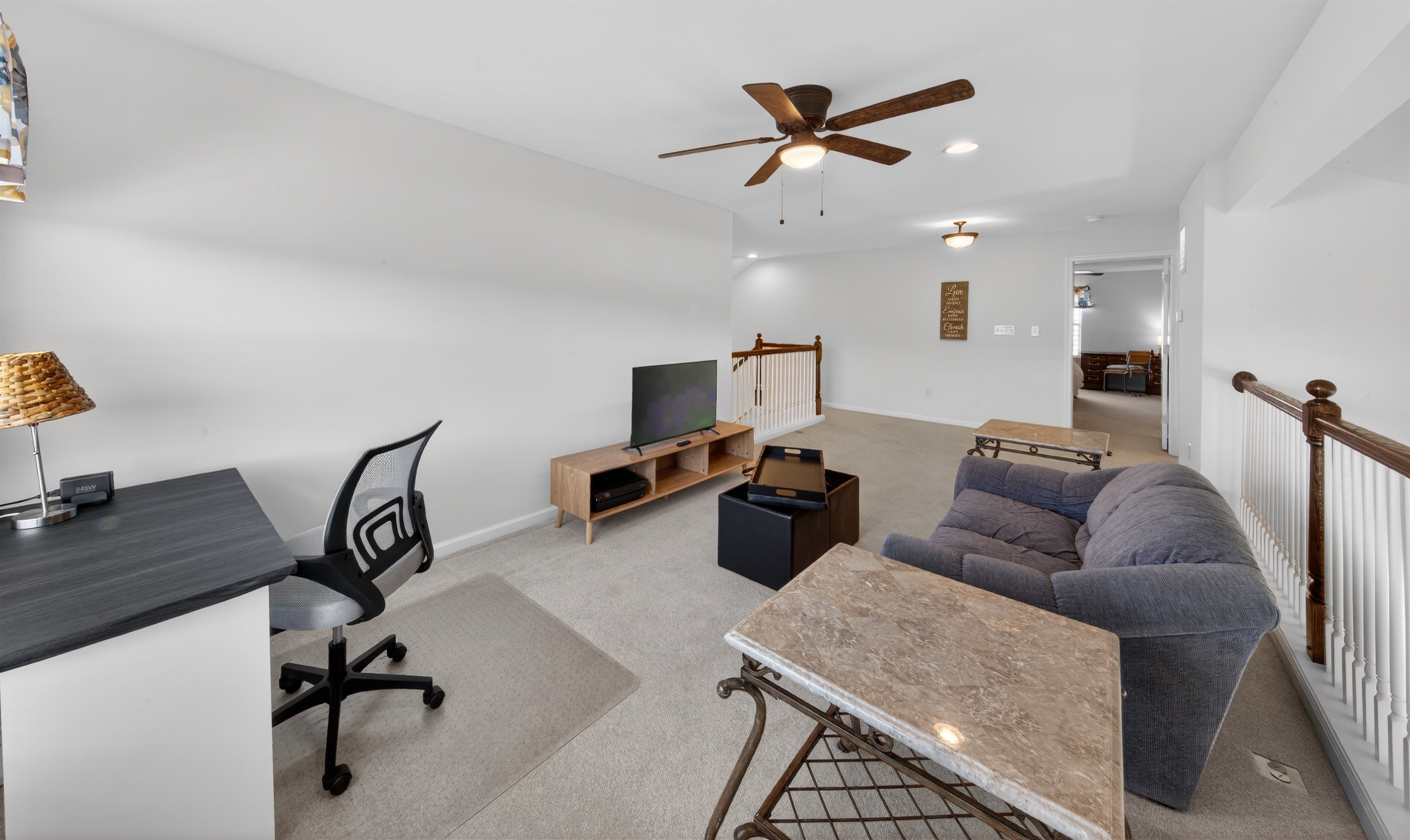 Loft workspace with printer and Roku TV