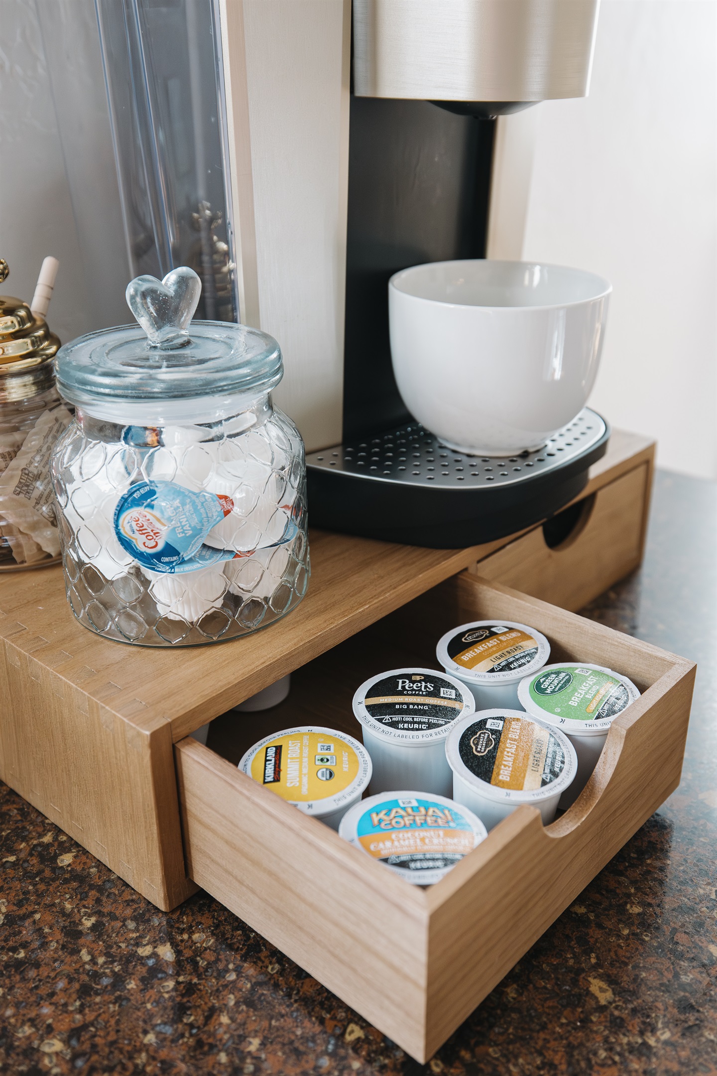 Fully stocked Keurig coffee bar with a variety of pods, creamers, and mugs—perfect for slow mornings or fueling up before skiing, hiking, and lake adventures in Pinetop.