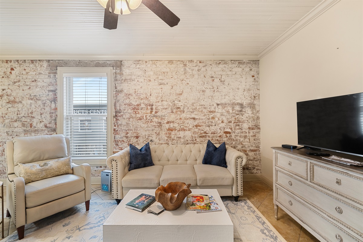 Modern elegance meets rustic charm with plush seating and inviting decor