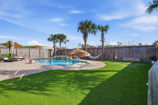 Private backyard putting green at this pet-friendly Panama City Beach vacation rental close to the beach.