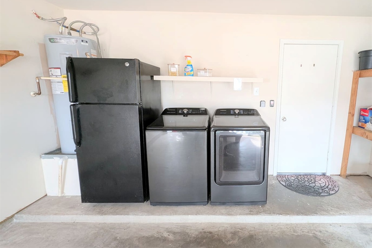 Guests have access to secondary refrigerator and freezer as well as washer and dryer in the garage. 