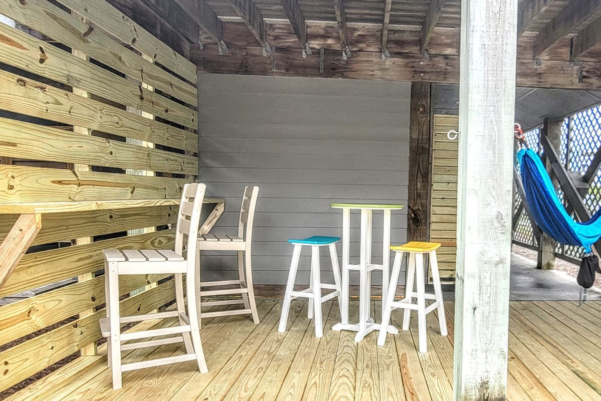 Sit at the tiki bar on the lower level and start your evening right &mdash; cold drinks, warm air, good company.