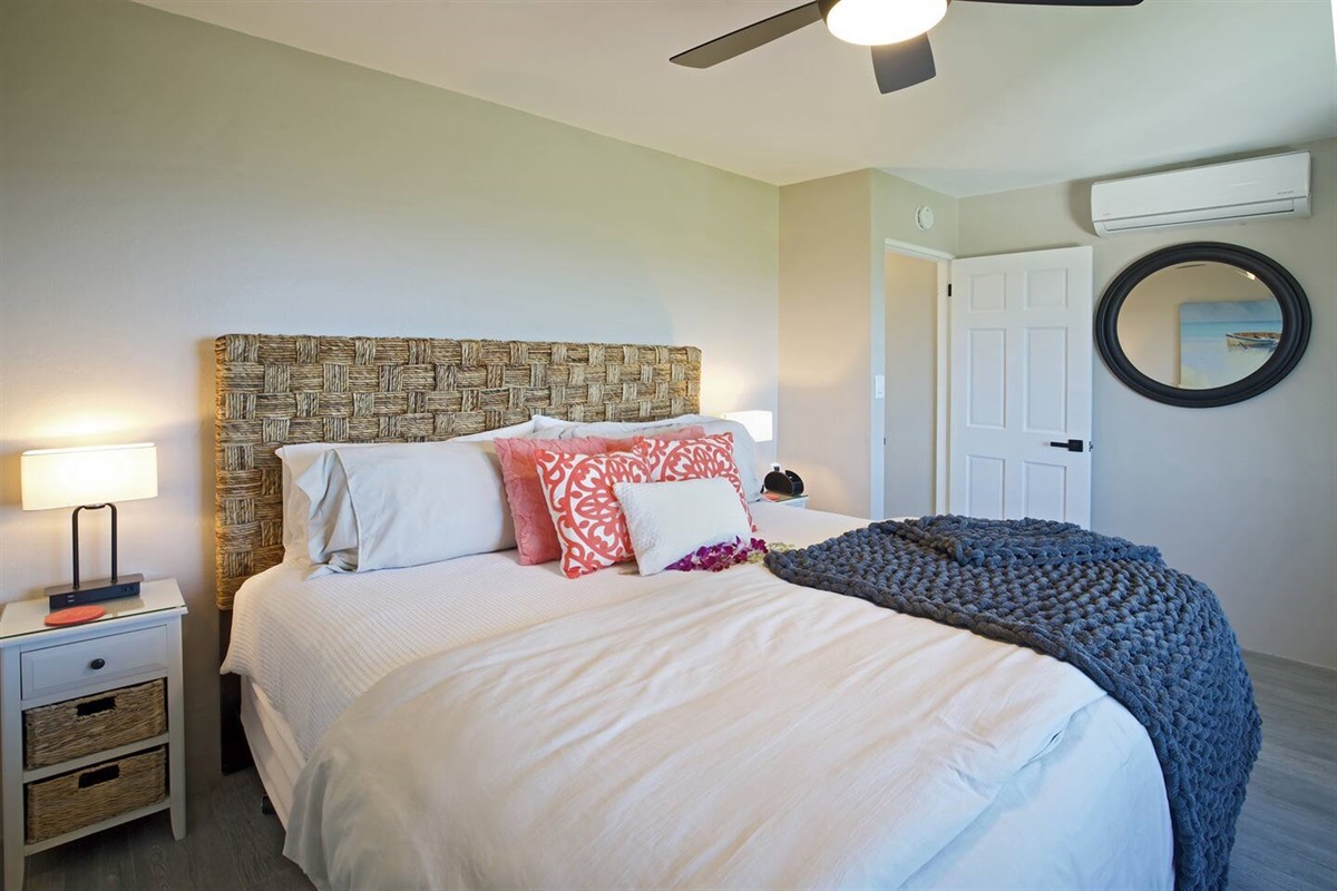 Sleek and stylish bedroom designed for comfort and tranquility. Maximize your comfort with the ceiling fan and ac unit to stay cool throughout your stay.