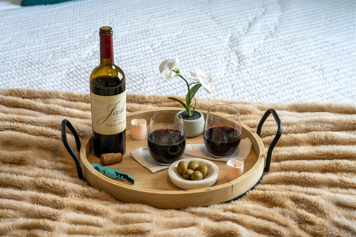 Experience hotel-level luxury with high-thread-count bedding, ambient lighting, and tasteful decor throughout the room.