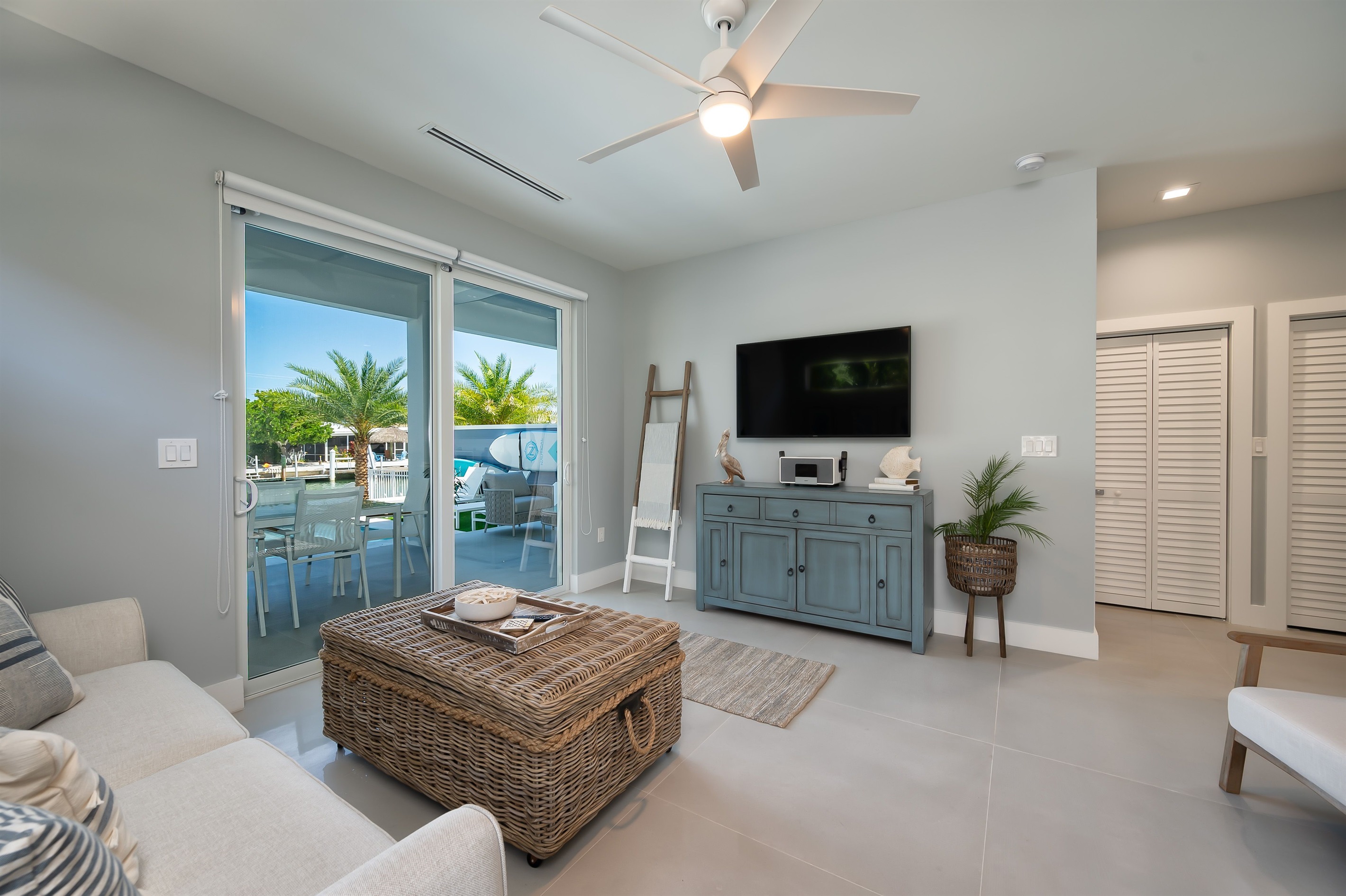 Downstairs living room with access to patio and sleeper sofa