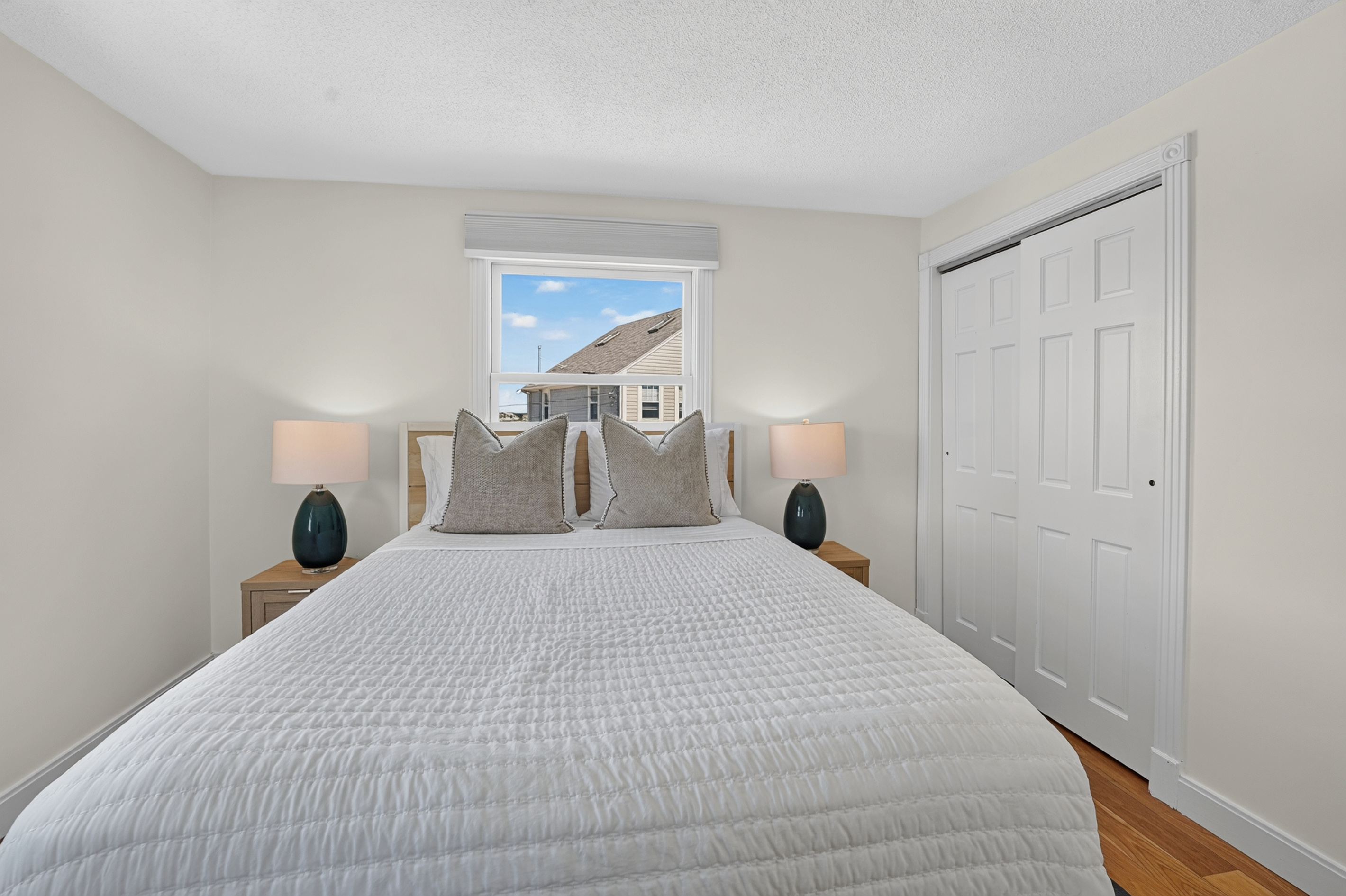Comfortable bedroom designed for restful nights with convenient storage and bedside lighting.