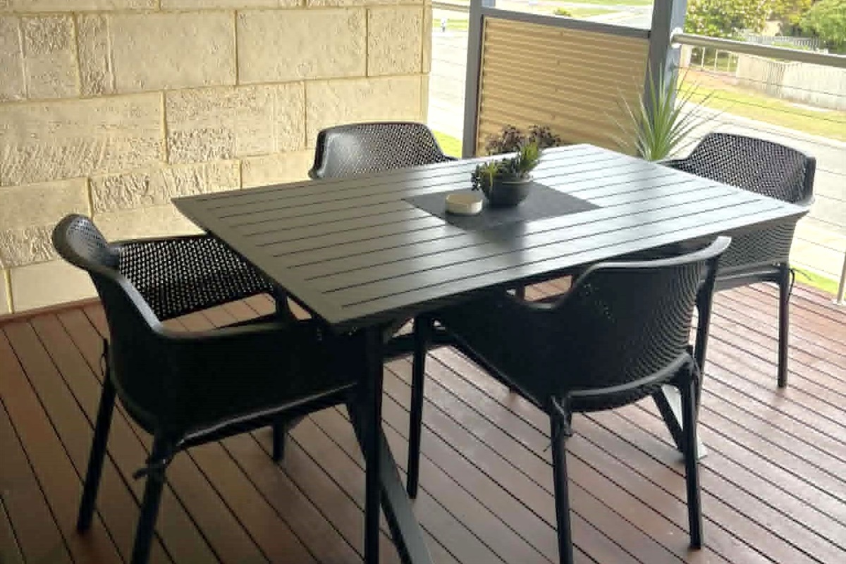 Outdoor dining on the private balcony with BBQ