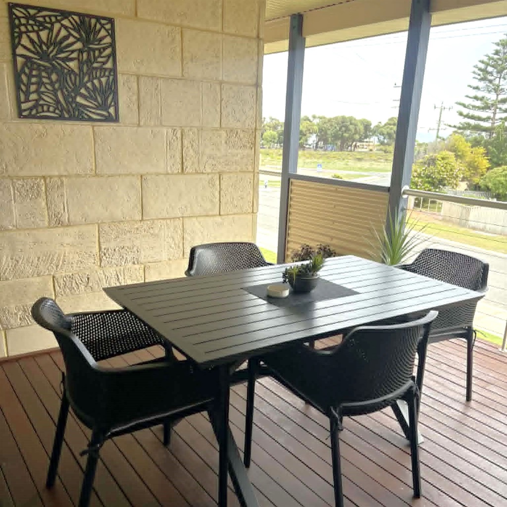 Outdoor dining on the private balcony with BBQ