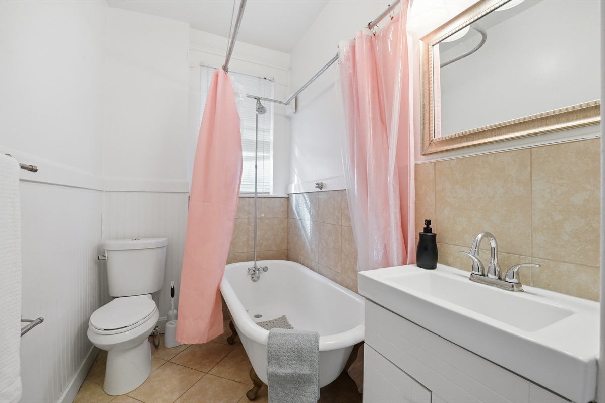 Full bathroom with shower and tub